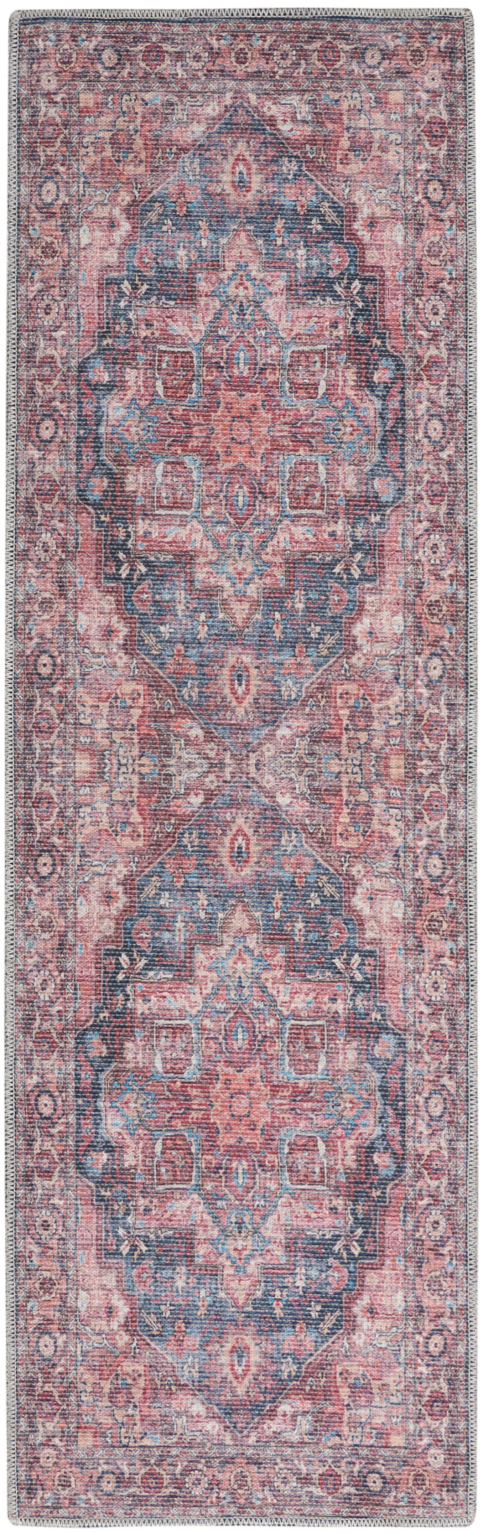 Persian-style runner rug in pink and blue with a central medallion and distressed floral border.