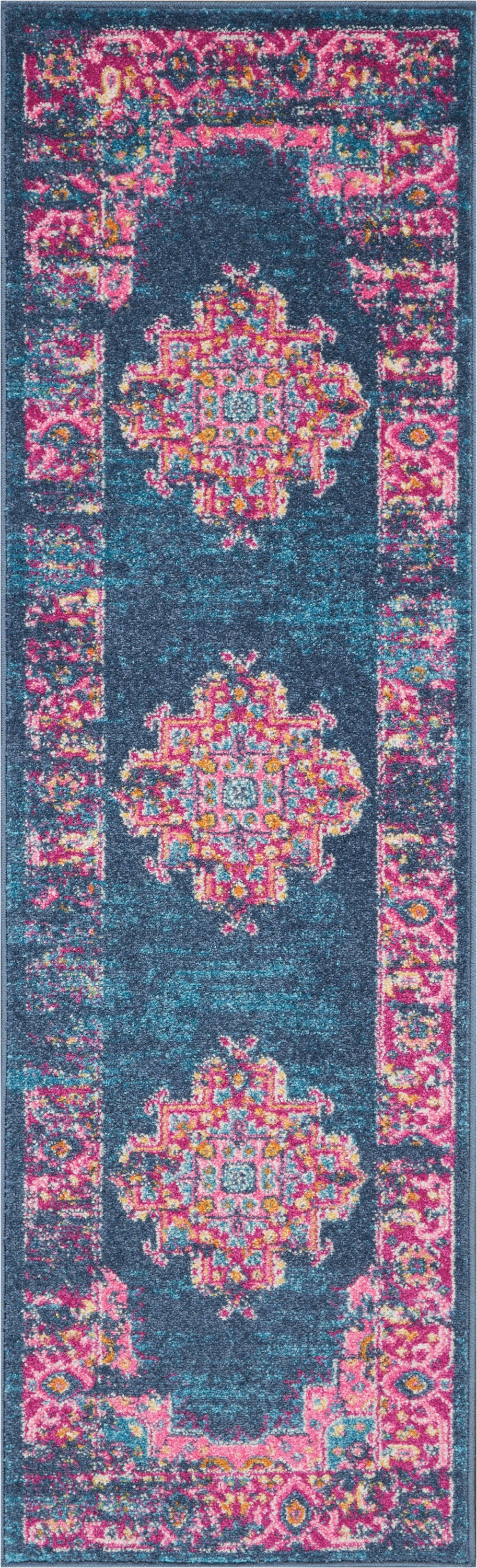 Long turquoise runner rug with pink border and repeating ornate multicolor medallions in teal, pink and yellow.