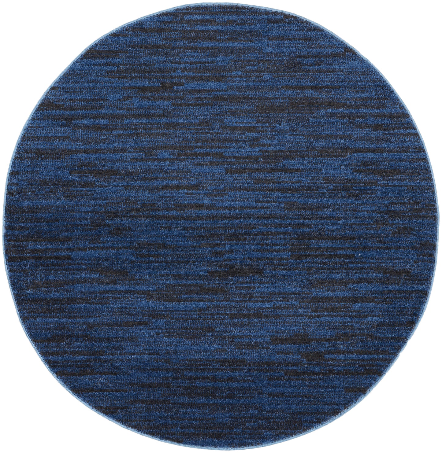 Round blue rug with navy and cobalt marled pattern, woven texture for modern living spaces.