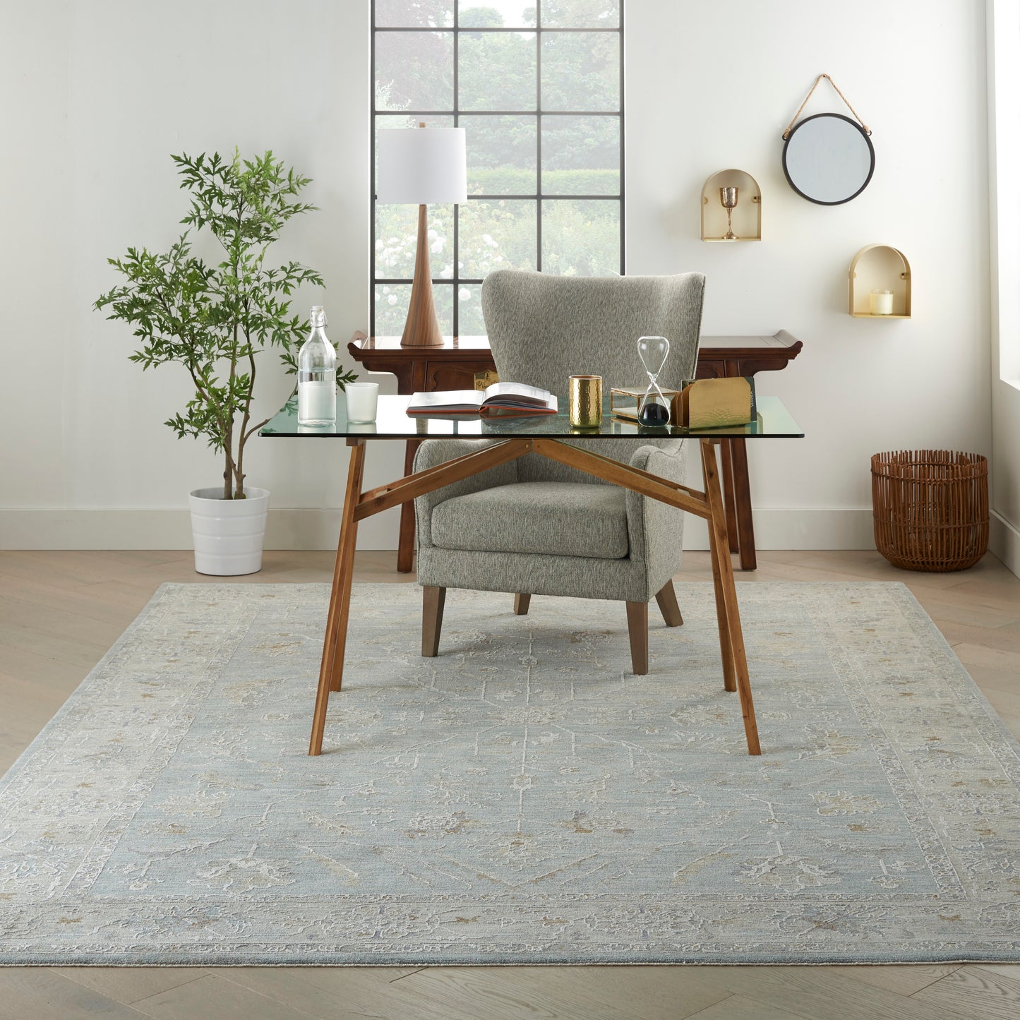 Vintage 8' x 10' rug in a bright room with a plant nearby.