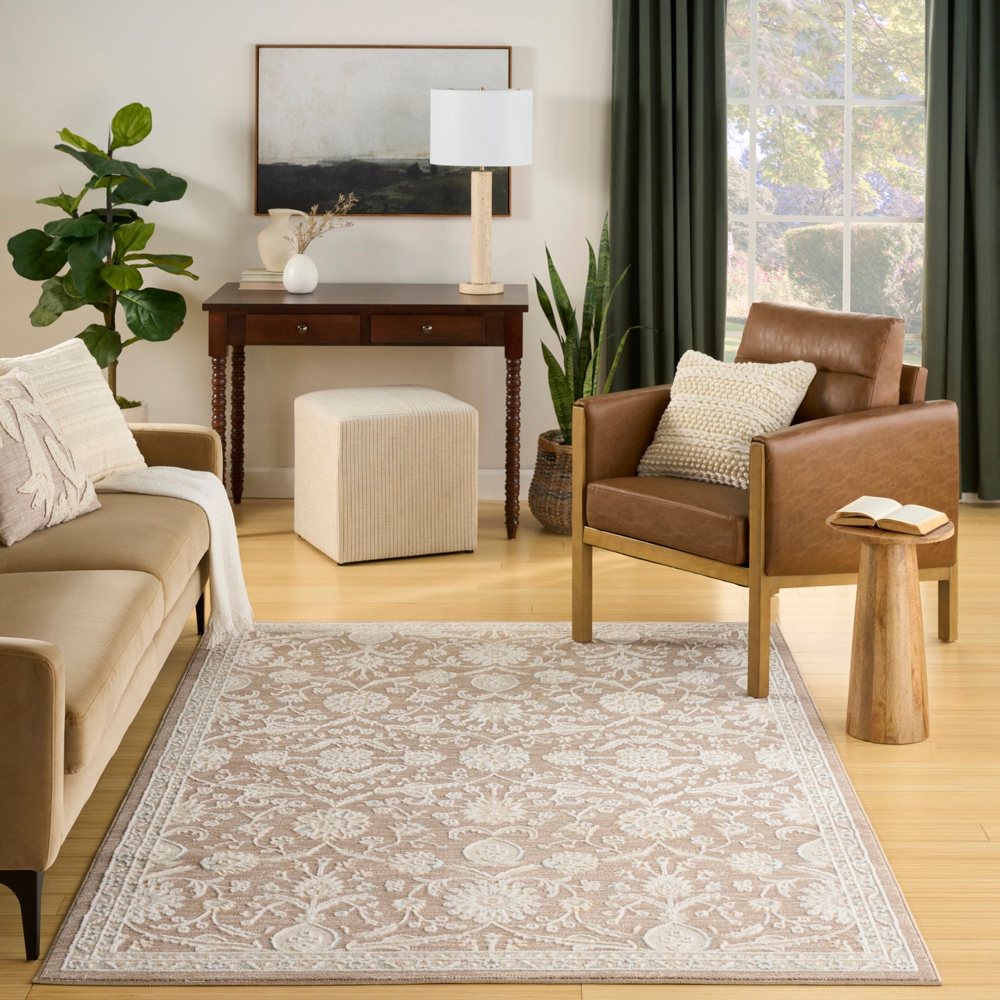Cozy living room with beige sofa, brown leather armchair, gray-beige patterned rug, wooden console table, lamp and plants.