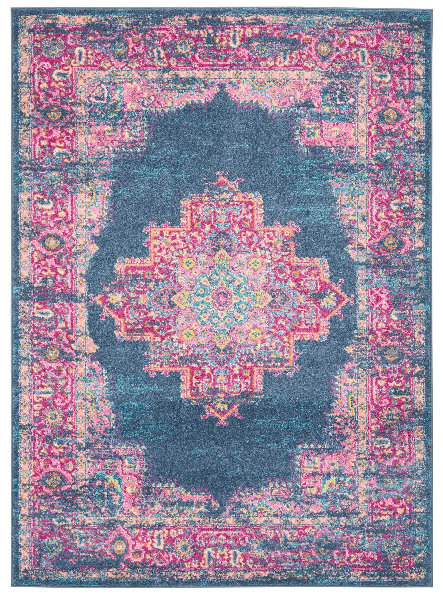 Distressed vintage-style rug with deep blue field, pink patterned border, and multicolor central medallion.
