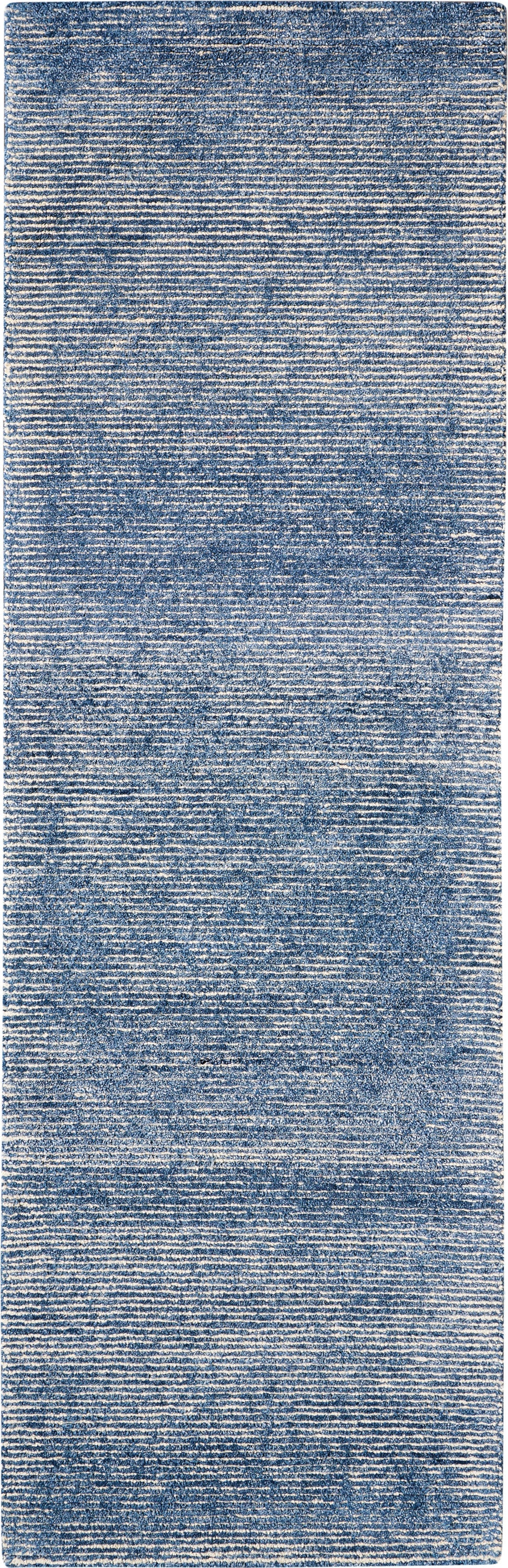 Blue denim-style woven runner rug with distressed texture, casual modern home décor.
