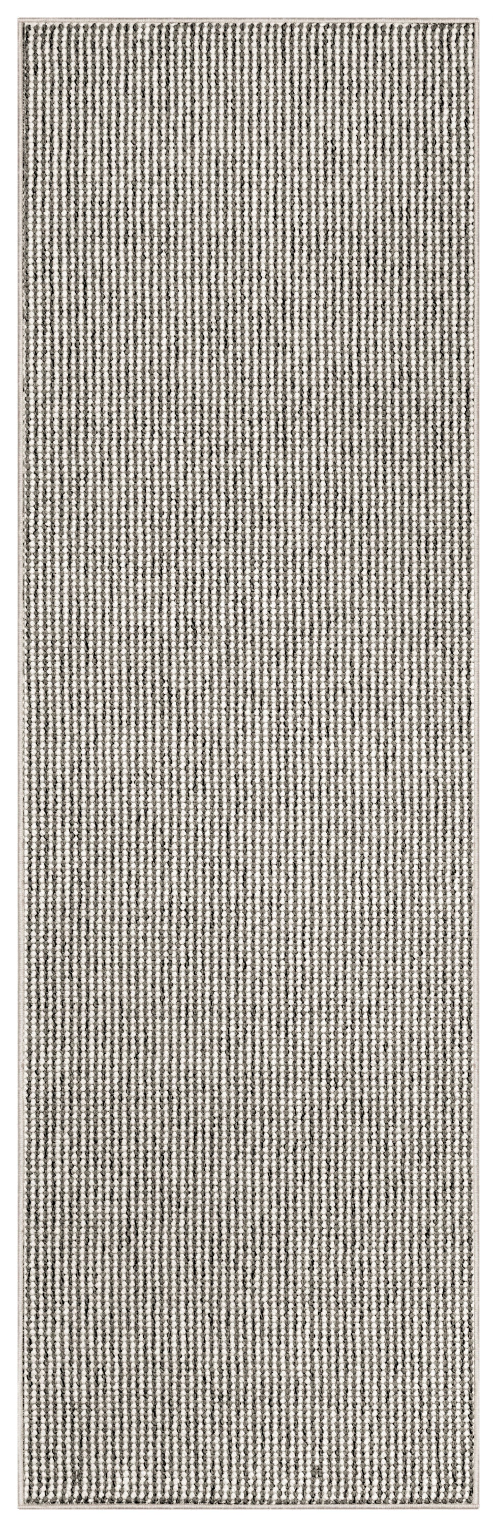 Neutral woven runner rug with small speckled stripes in black, gray & ivory; textured looped pile & beige edging.