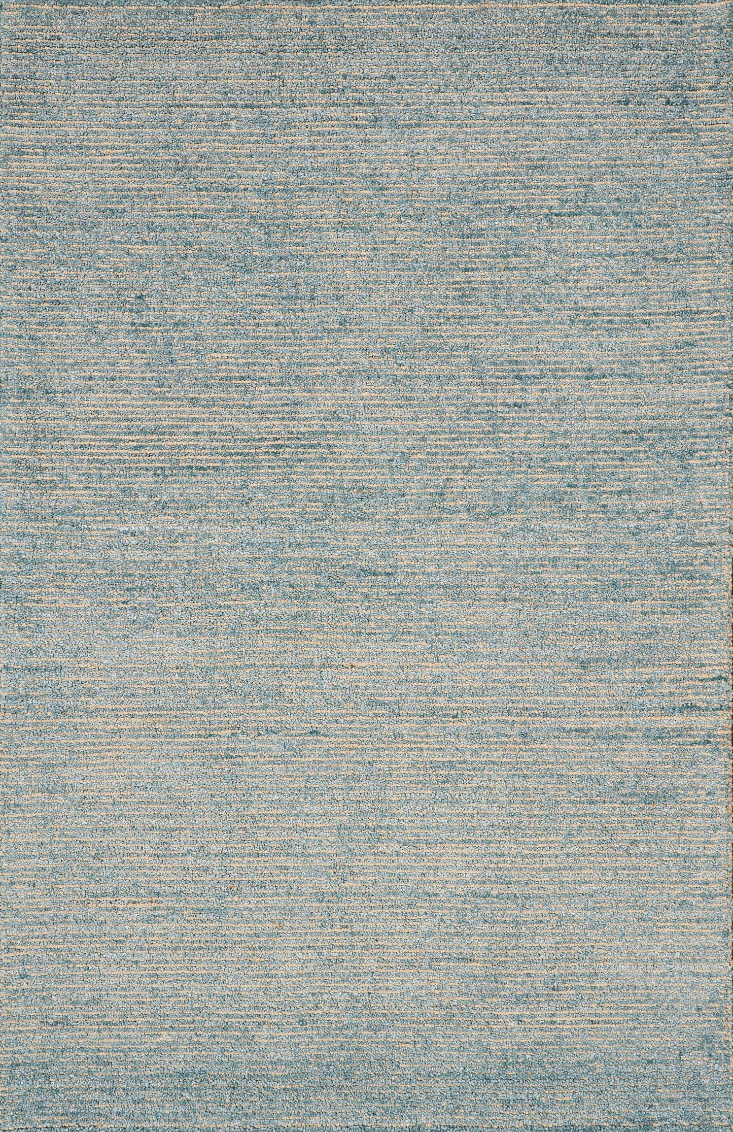 Rectangular flat-weave rug in blue and beige tones with subtle distressed texture, contemporary living room accent.