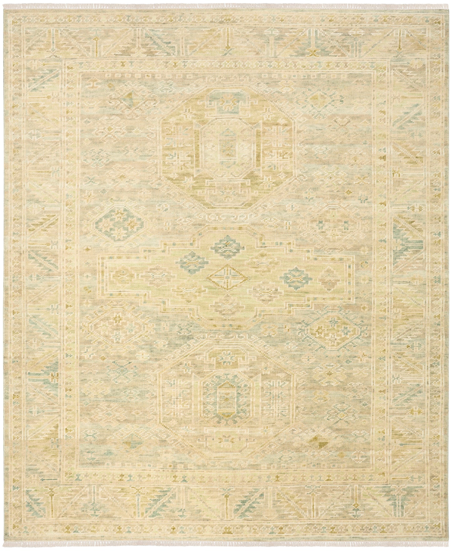 Soft vintage-inspired rug in cream, beige and pale blue with geometric medallions and an intricate border.