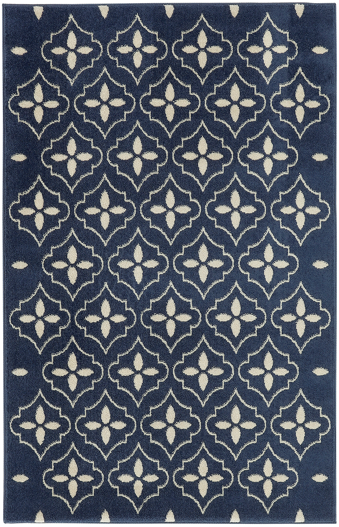 Navy area rug with cream geometric quattrofoil motifs; repeating pattern, soft textured flat-weave, modern traditional style.
