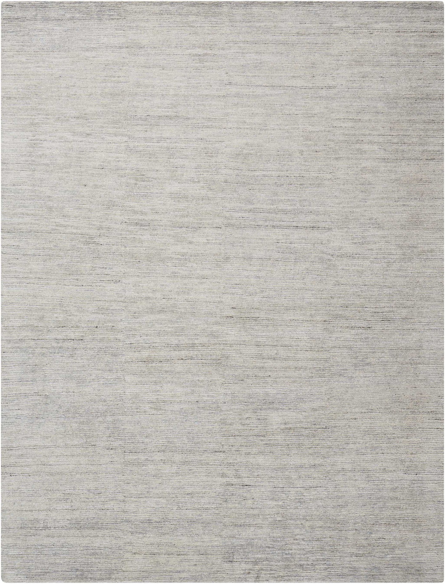 Neutral gray flat-weave rug with soft texture and tonal variation, rectangular for living rooms.