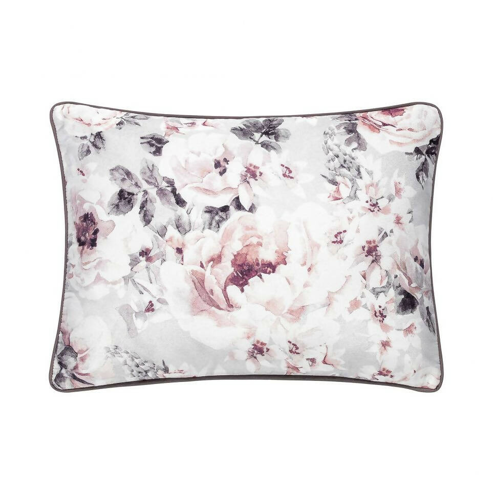 Soft rectangular pillow featuring a delicate floral pattern in pink, white, and grey tones, bordered with a dark trim.