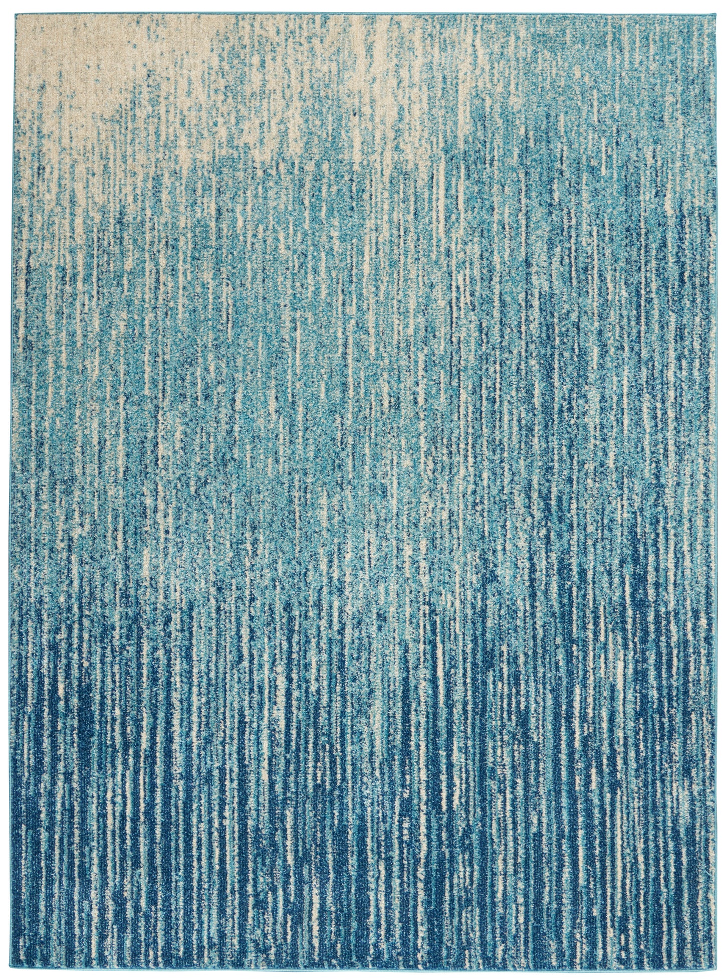 Blue tonal area rug with vertical streaks in aqua to navy, modern abstract pattern.