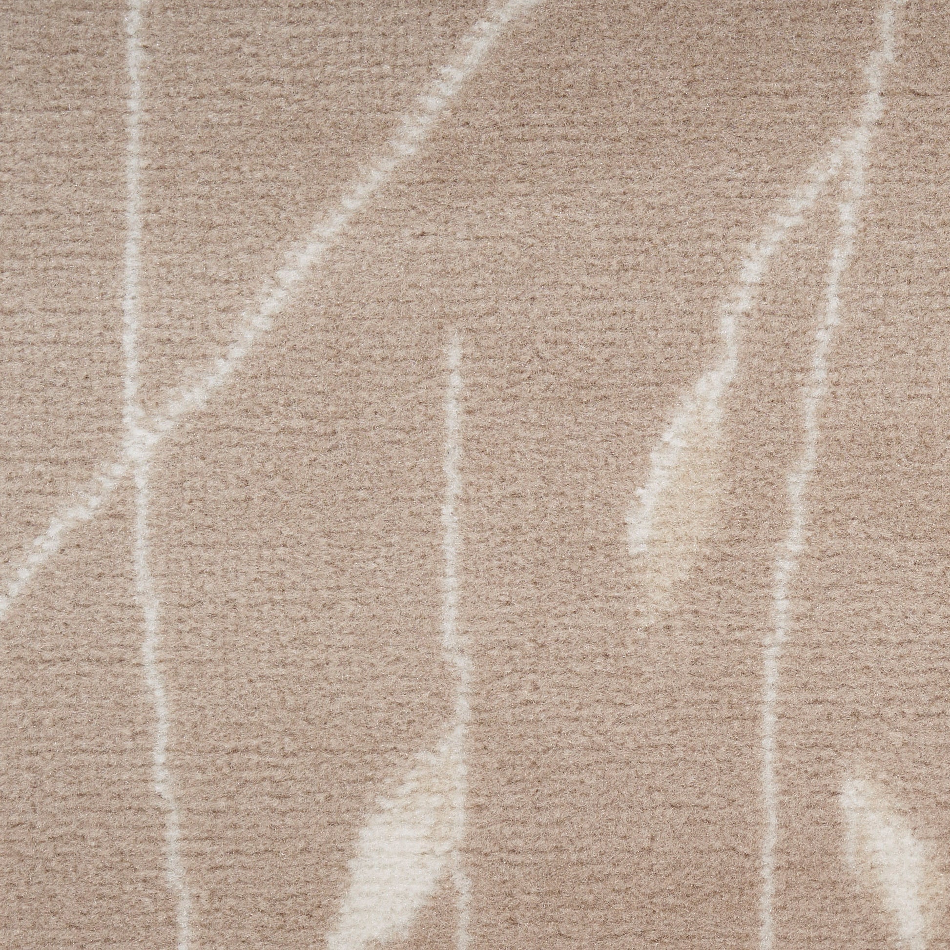 Beige shag rug with white abstract linear pattern and plush texture.