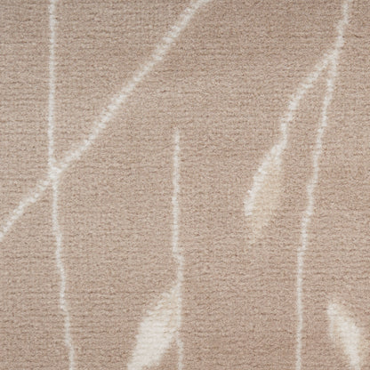 Beige shag rug with white abstract linear pattern and plush texture.