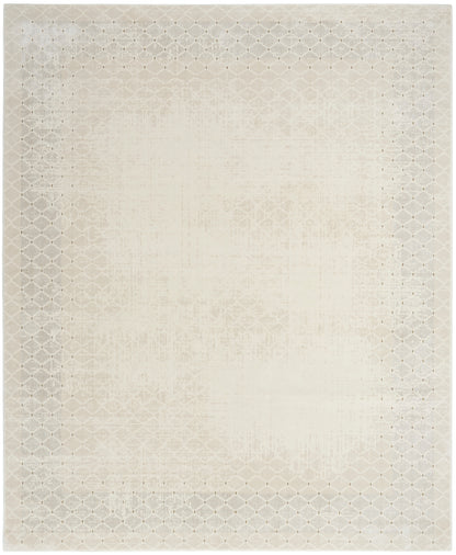 Beige rectangular area rug with subtle distressed central pattern and pale lattice border.