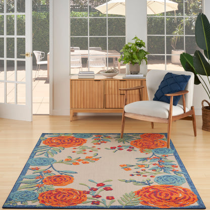 Rectangular outdoor rug (6' x 9') with orange roses, teal leaves and blue border.