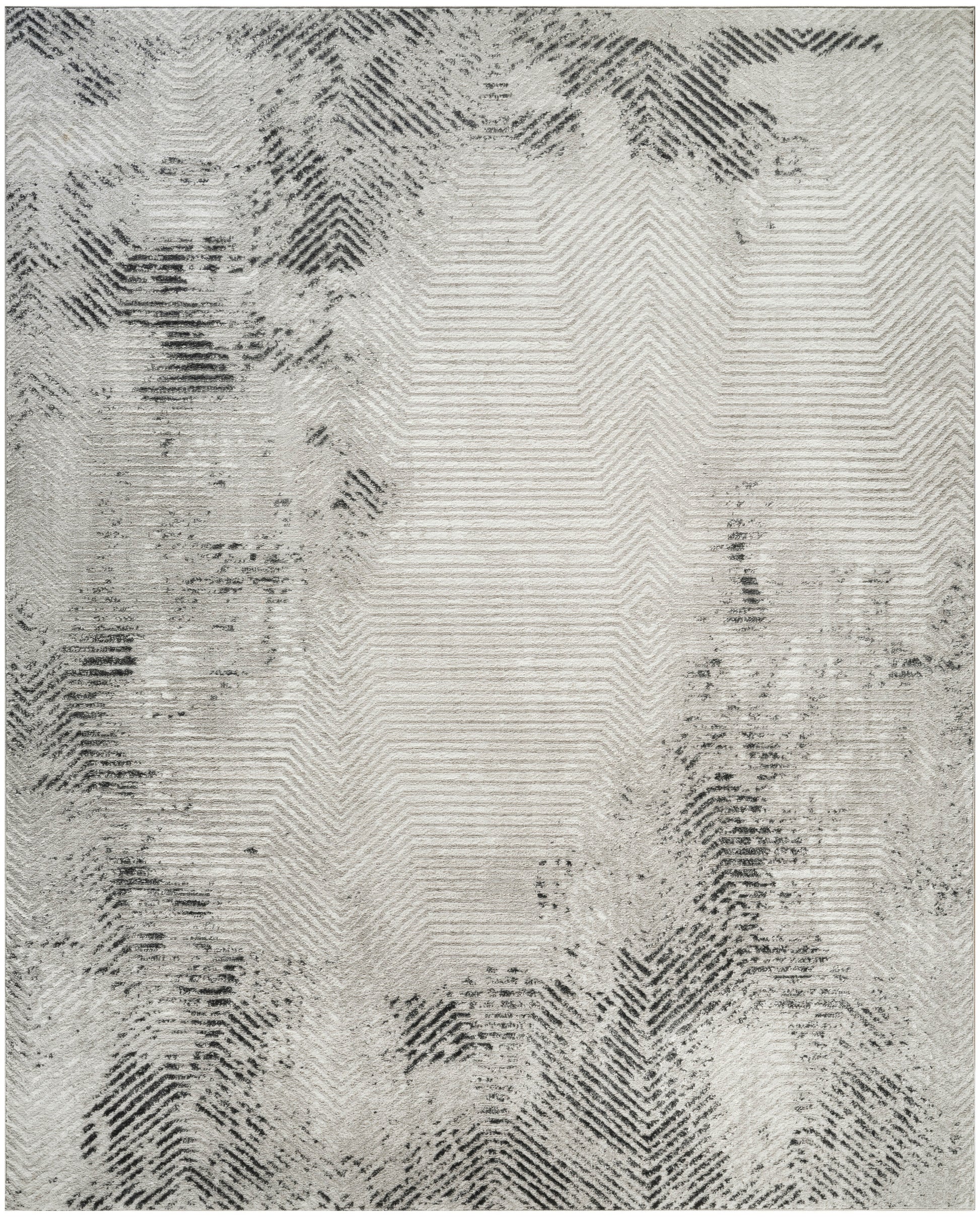 Gray and ivory area rug with a subtle chevron/herringbone pattern and irregular dark edges.