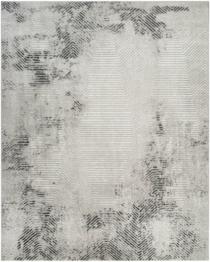 Gray and ivory area rug with a subtle chevron/herringbone pattern and irregular dark edges.
