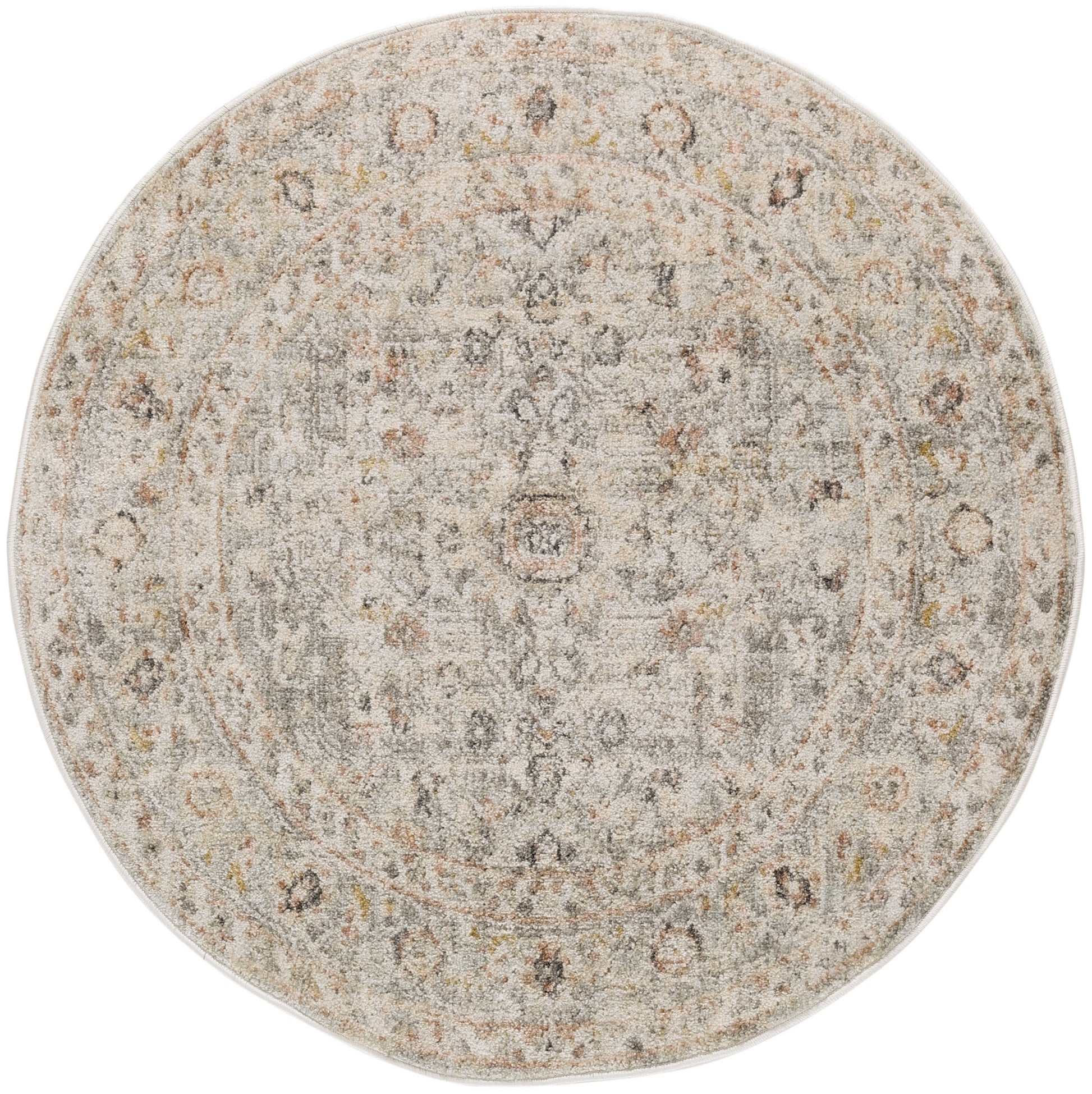 Round vintage-style area rug in light gray-beige with distressed pattern, subtle rust-yellow accents and central medallion.