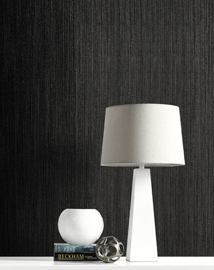Black textured wallpaper with vertical stria design and subtle metallic shimmer, Natural Stria luxury wallcovering in ebony tone for modern minimalist, masculine, and high end interior design accent walls.