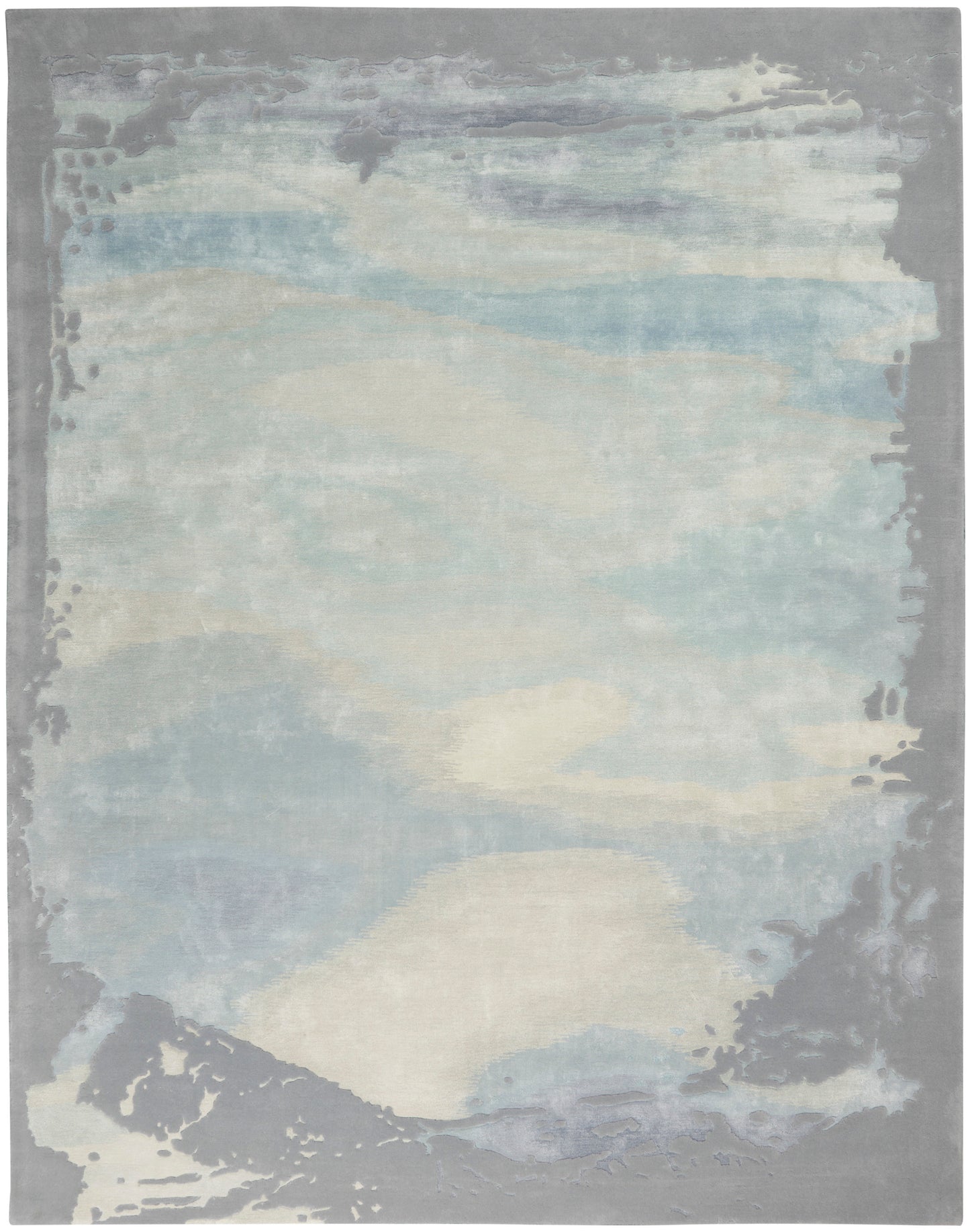 Abstract pastel area rug in pale blues, creams, and gray with a muted border and cloudlike pattern.