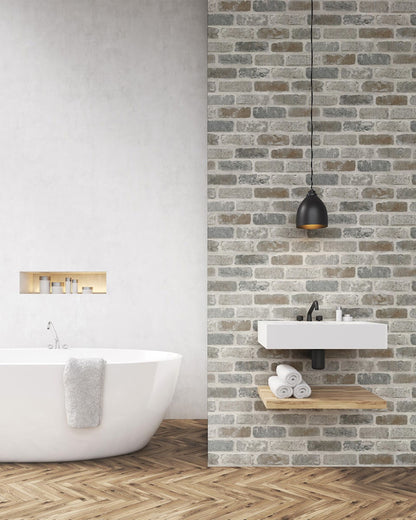 Realistic faux brick peel and stick wallcovering in gray and rust tones, Washed Brick design by NextWall, exposed brick look wallpaper for industrial accent walls, removable and washable wallcovering for modern loft-style interiors