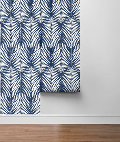 Palm Silhouette Coastal Blue peel and stick wallpaper featuring tropical palm leaf silhouettes in soft coastal blue tones, removable renter-friendly botanical wallpaper by NextWall, ideal for modern coastal, boho, and tropical accent wall home décor in bedrooms, living rooms, offices, and entryways.