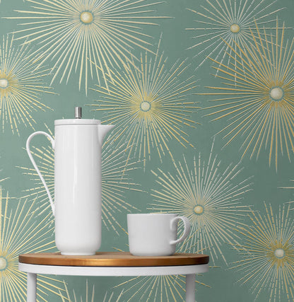 Modern teal and metallic gold geometric peel and stick wallpaper with starburst pattern, removable accent wall covering for living room, bedroom, or office, stylish contemporary home decor solution for rentals and DIY interior design.