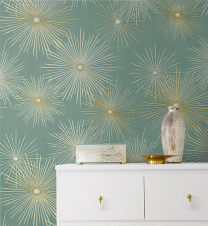 Modern teal and metallic gold geometric peel and stick wallpaper with starburst pattern, removable accent wall covering for living room, bedroom, or office, stylish contemporary home decor solution for rentals and DIY interior design.
