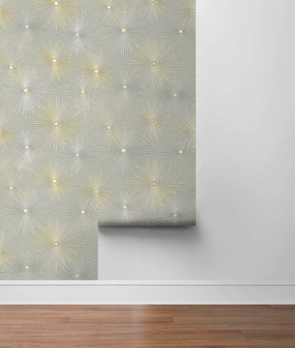 Modern Starburst Geo peel and stick wallpaper in silver smoke gray and metallic gold featuring a bold geometric starburst pattern. Removable wallpaper perfect for glam interiors, art deco décor, contemporary living rooms, bedrooms, offices, and luxury accent walls.