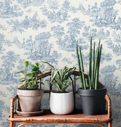 Blue Bell Chateau Toile peel and stick wallpaper with detailed scenic toile pattern in soft blue tones, removable renter friendly wallpaper for vintage accent walls, French country style wall decor for bedrooms and living rooms, NextWall NW43302