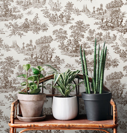 Chateau Toile Peel and Stick Wallpaper in Sable Brown featuring classic French toile scenic patterns in warm brown and taupe tones. Removable vintage-inspired wallpaper ideal for accent walls, dining rooms, bedrooms, powder rooms, entryways, apartments, French country homes, cottagecore interiors, traditional décor, and grandmillennial style spaces. Washable peel and stick wallcovering perfect for elegant DIY home decorating and timeless interior design.