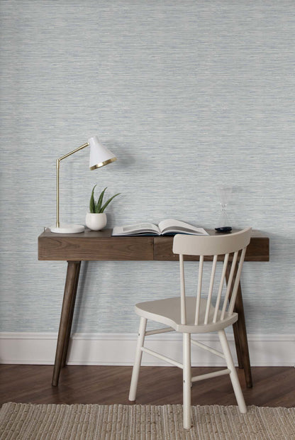 Cyrus Faux Grasscloth peel and stick wallpaper in Dove Grey and Bluestone featuring a realistic woven grasscloth texture. Blue-gray removable wallpaper ideal for coastal, contemporary, modern, farmhouse, and transitional interiors, including bedrooms, living rooms, home offices, dining rooms, and elegant accent walls.