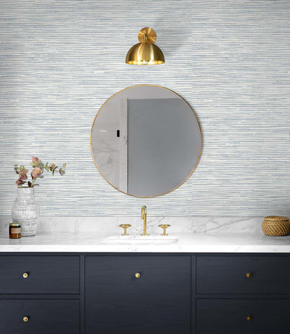 Cyrus Faux Grasscloth peel and stick wallpaper in Dove Grey and Bluestone featuring a realistic woven grasscloth texture. Blue-gray removable wallpaper ideal for coastal, contemporary, modern, farmhouse, and transitional interiors, including bedrooms, living rooms, home offices, dining rooms, and elegant accent walls.