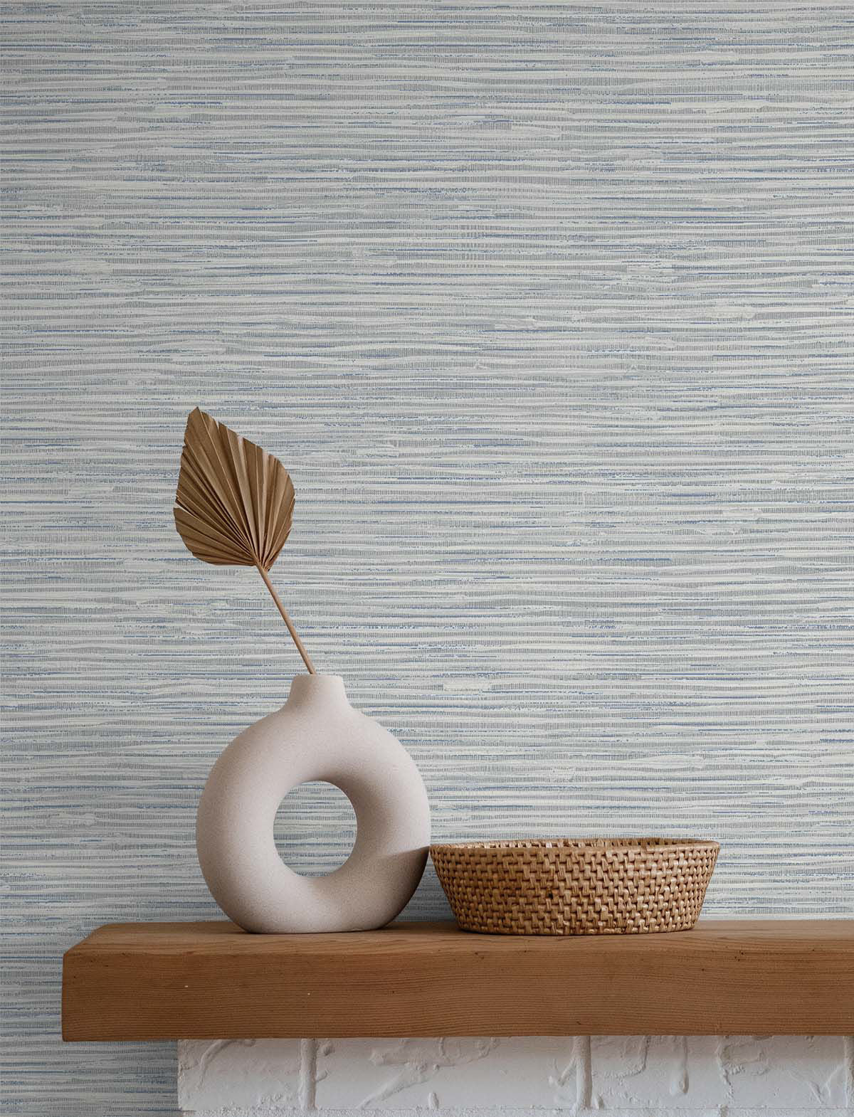 Cyrus Faux Grasscloth peel and stick wallpaper in Dove Grey and Bluestone featuring a realistic woven grasscloth texture. Blue-gray removable wallpaper ideal for coastal, contemporary, modern, farmhouse, and transitional interiors, including bedrooms, living rooms, home offices, dining rooms, and elegant accent walls.