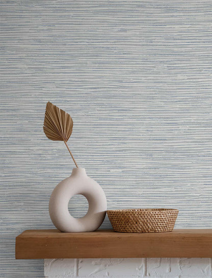 Cyrus Faux Grasscloth peel and stick wallpaper in Dove Grey and Bluestone featuring a realistic woven grasscloth texture. Blue-gray removable wallpaper ideal for coastal, contemporary, modern, farmhouse, and transitional interiors, including bedrooms, living rooms, home offices, dining rooms, and elegant accent walls.