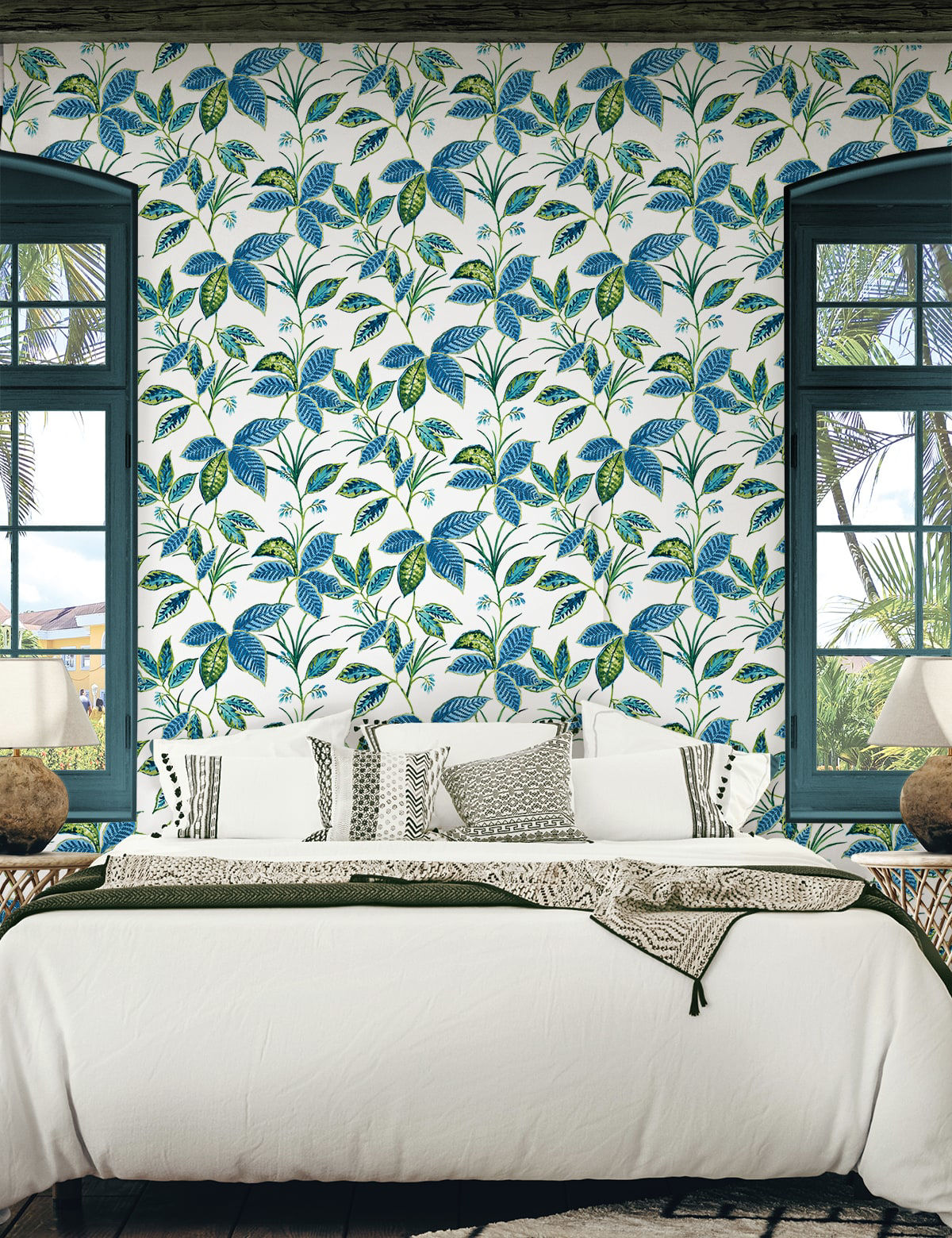 Boho Leaf Trail Peel and Stick Wallpaper in Lagoon featuring a soft, flowing botanical pattern of trailing leaves and subtle floral accents in layered blue tones. This bohemian-inspired wallpaper creates a relaxed, nature-inspired backdrop for accent walls in bedrooms, living rooms, nurseries, bathrooms, entryways, and home offices. Removable peel and stick design that is renter-friendly, washable, and easy to apply for effortless interior updates.