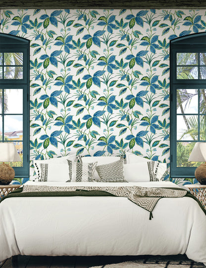 Boho Leaf Trail Peel and Stick Wallpaper in Lagoon featuring a soft, flowing botanical pattern of trailing leaves and subtle floral accents in layered blue tones. This bohemian-inspired wallpaper creates a relaxed, nature-inspired backdrop for accent walls in bedrooms, living rooms, nurseries, bathrooms, entryways, and home offices. Removable peel and stick design that is renter-friendly, washable, and easy to apply for effortless interior updates.
