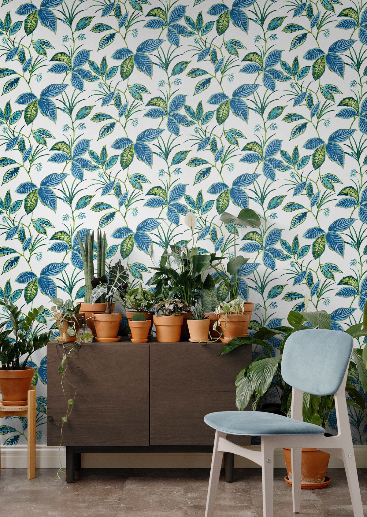 Boho Leaf Trail Peel and Stick Wallpaper in Lagoon featuring a soft, flowing botanical pattern of trailing leaves and subtle floral accents in layered blue tones. This bohemian-inspired wallpaper creates a relaxed, nature-inspired backdrop for accent walls in bedrooms, living rooms, nurseries, bathrooms, entryways, and home offices. Removable peel and stick design that is renter-friendly, washable, and easy to apply for effortless interior updates.