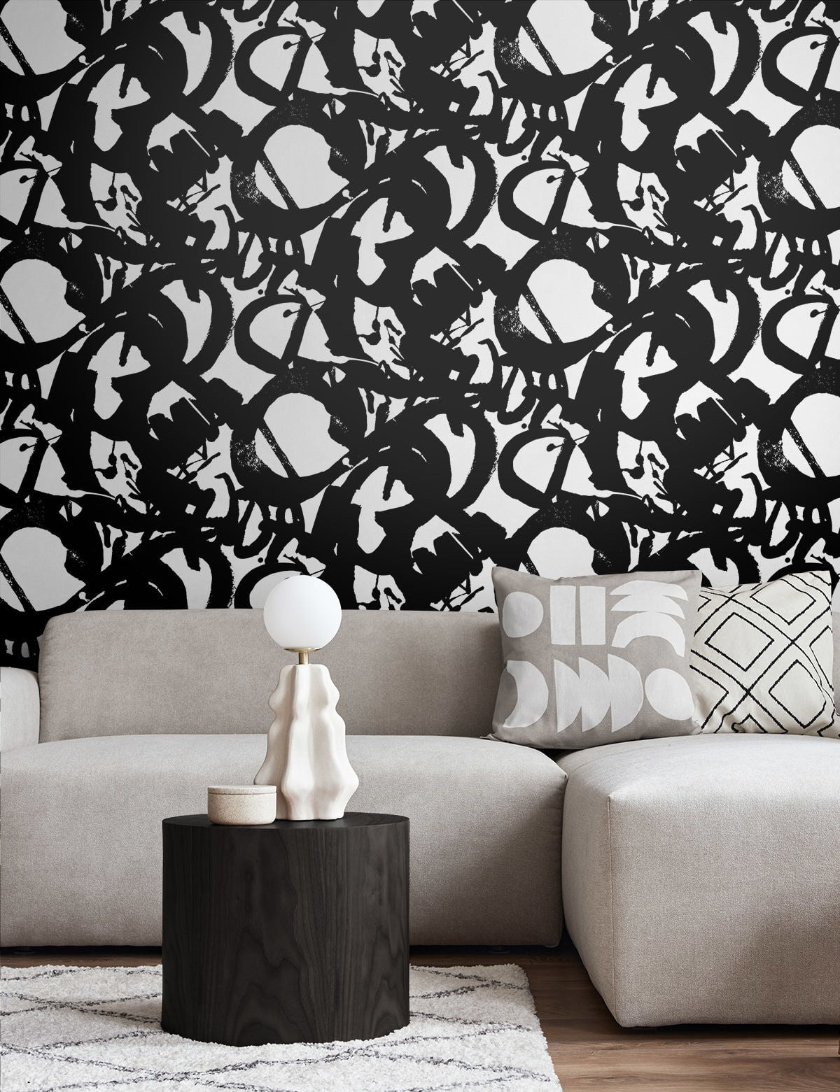 Onyx black and white abstract peel-and-stick wallpaper featuring dramatic oversized ink brushstrokes and an artistic hand-painted pattern. Bold modern wallpaper for statement accent walls, bedrooms, living rooms, home offices, powder rooms and contemporary interior design.
