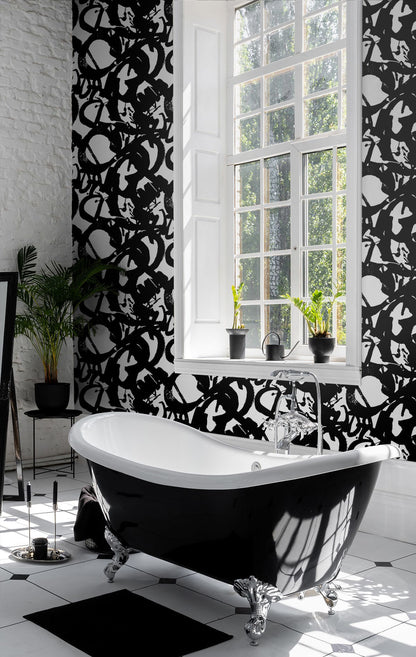Bold black and white abstract wallpaper with dramatic ink brushstrokes on a white background. This Onyx peel-and-stick wallpaper adds artistic character to living rooms, bedrooms, home offices, powder rooms, entryways and modern accent walls.