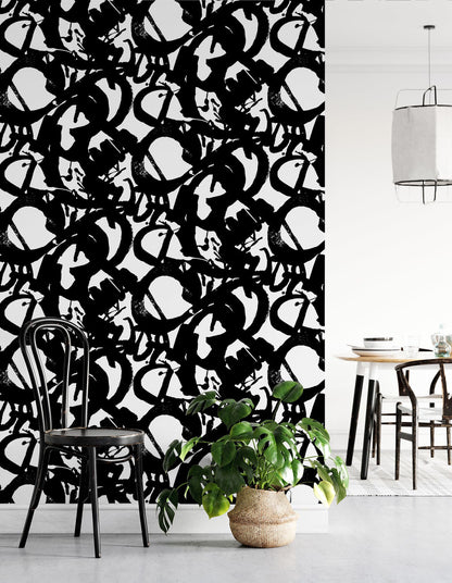 Bold black and white abstract wallpaper with dramatic ink brushstrokes on a white background. This Onyx peel-and-stick wallpaper adds artistic character to living rooms, bedrooms, home offices, powder rooms, entryways and modern accent walls.