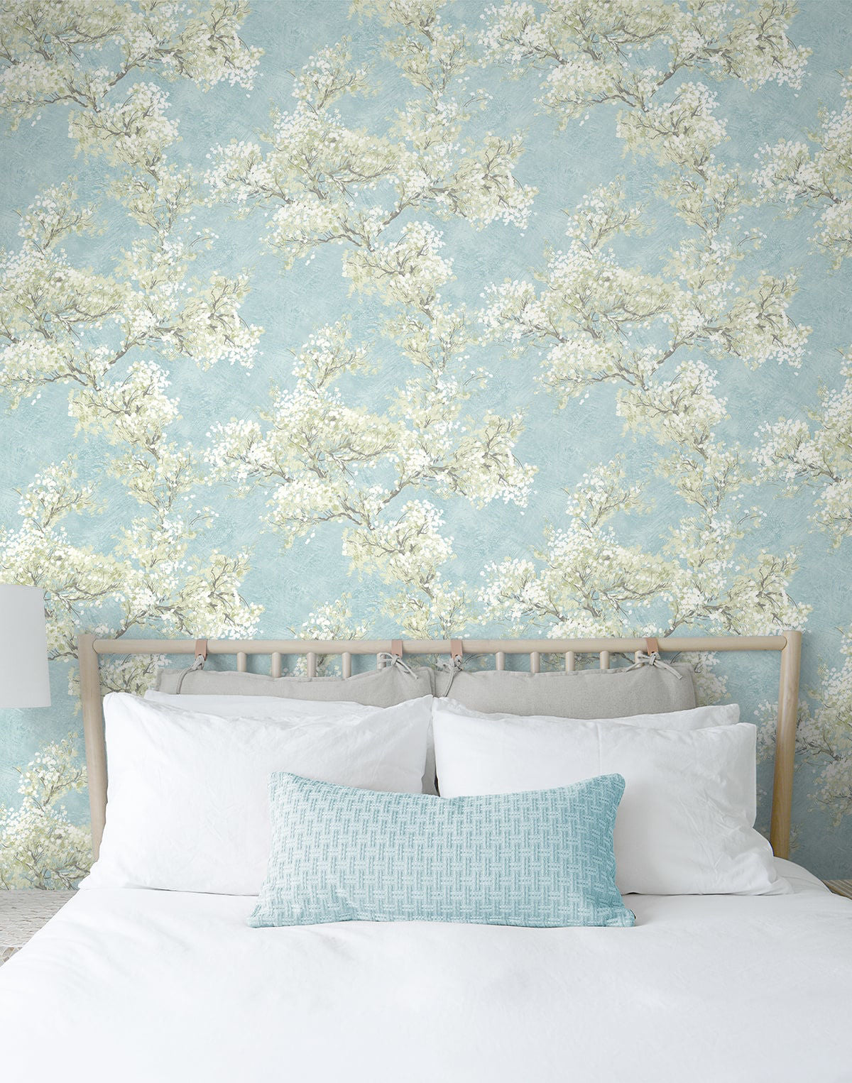 Blue floral peel and stick wallpaper featuring graceful cherry blossom branches, soft green foliage, and a serene garden-inspired pattern. Cherry Blossom Grove wallpaper in Blue Mist and Green Tea adds a fresh botanical look to accent walls, bedrooms, nurseries, living rooms, and modern cottage-style interiors. Easy-to-install removable wallpaper ideal for renters and home makeovers.