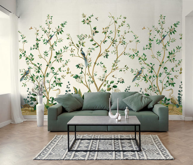 Silver botanical mural of trees and herons.