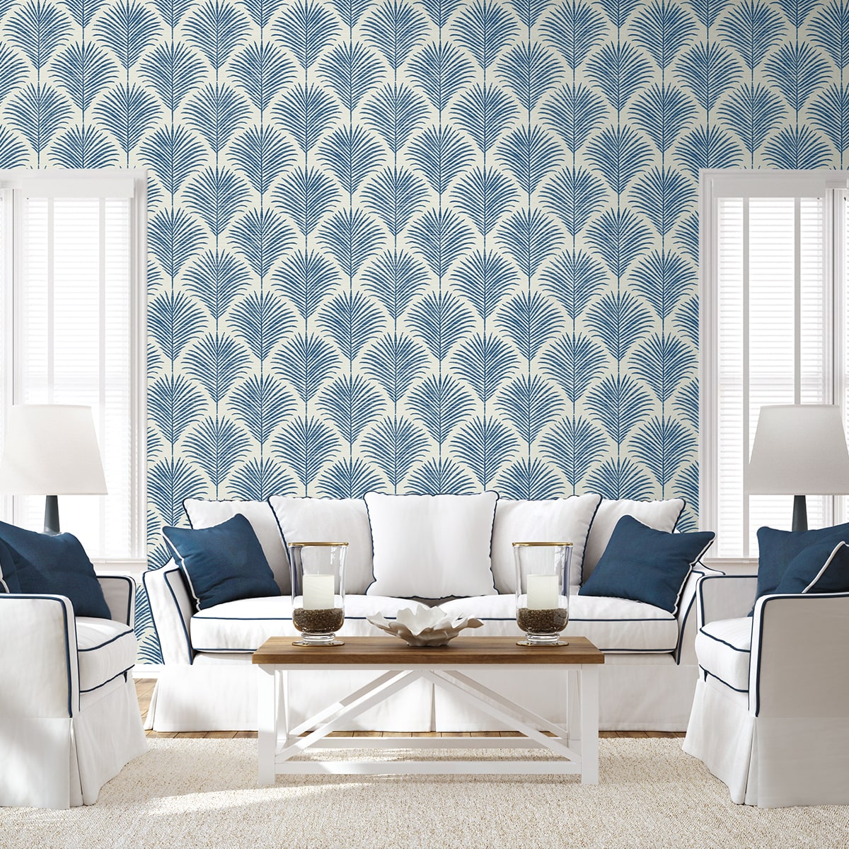 Coastal blue palm peel and stick wallpaper featuring tropical botanical leaves, removable wallcovering for beach house decor, accent walls, and modern coastal interior design.