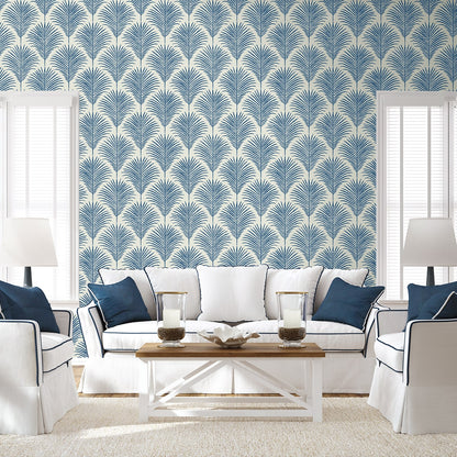 Coastal blue palm peel and stick wallpaper featuring tropical botanical leaves, removable wallcovering for beach house decor, accent walls, and modern coastal interior design.