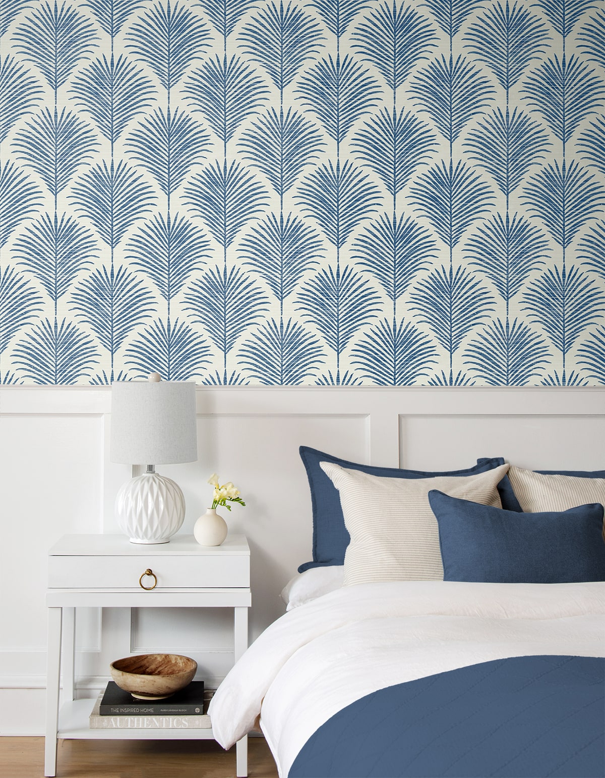 Coastal blue palm peel and stick wallpaper featuring tropical botanical leaves, removable wallcovering for beach house decor, accent walls, and modern coastal interior design.