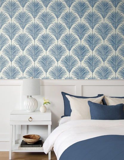Coastal blue palm peel and stick wallpaper featuring tropical botanical leaves, removable wallcovering for beach house decor, accent walls, and modern coastal interior design.