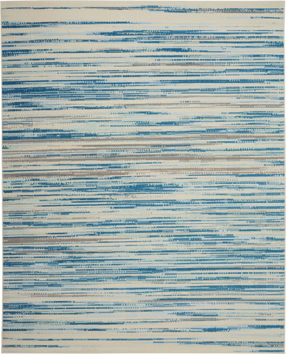 Rectangular rug with beige base and irregular blue brushstroke horizontal stripes, modern abstract style.