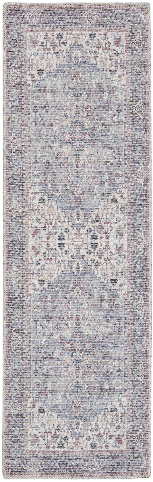 Vintage Persian-style runner rug in blue-gray and ivory with pale pink accents and ornate borders.