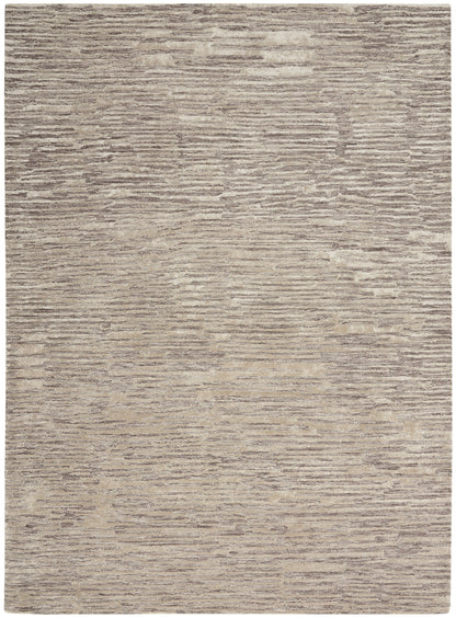 Rectangular beige and taupe rug with soft textured pile and muted horizontal stripe pattern.