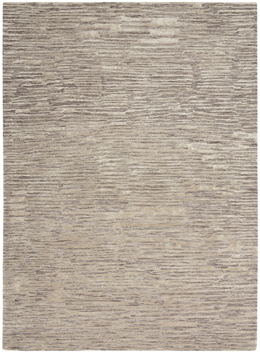 Rectangular beige and taupe rug with soft textured pile and muted horizontal stripe pattern.